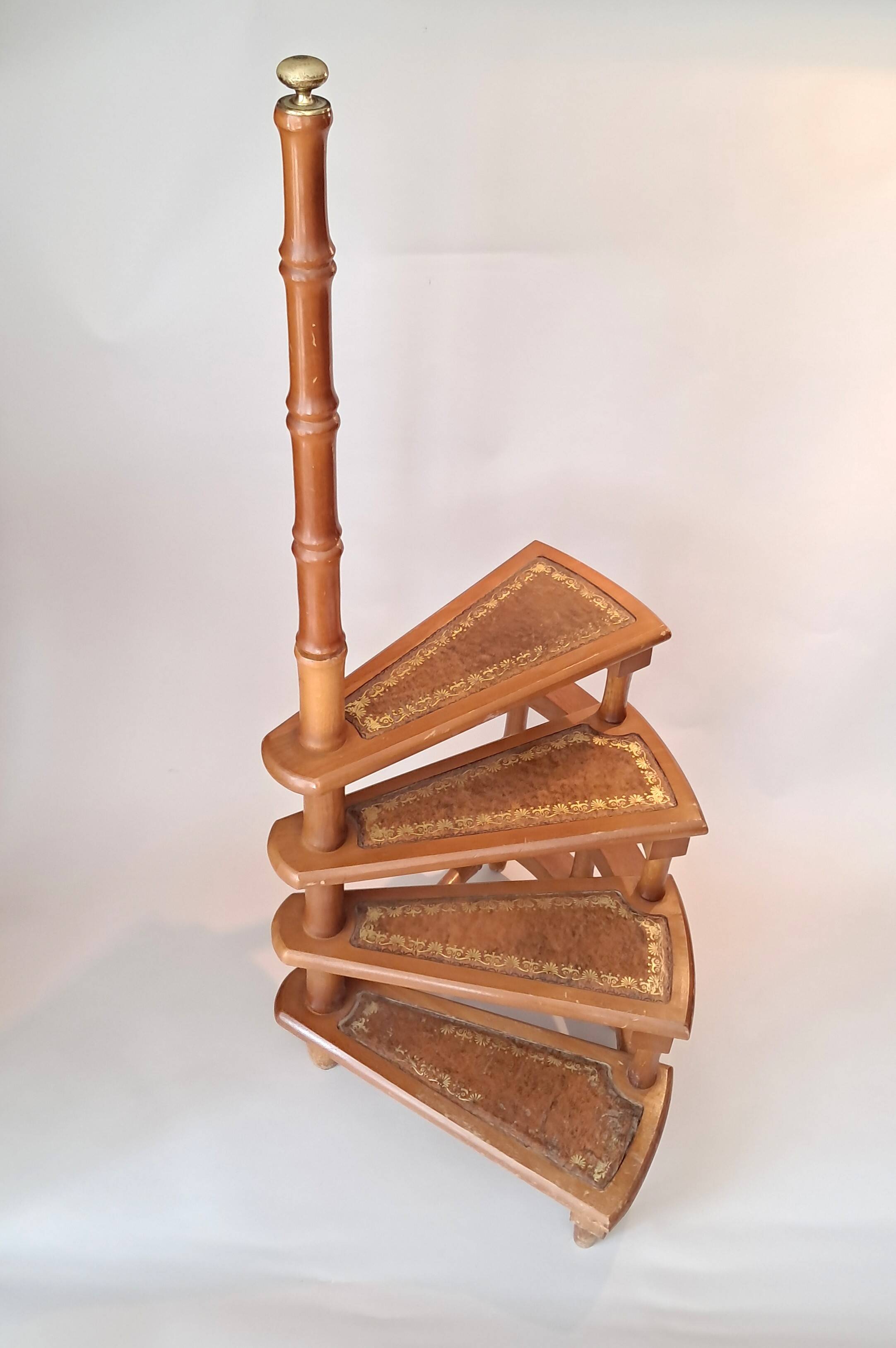Library spiral staircase in beech and brown leather.