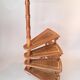 Library spiral staircase in beech and brown leather.