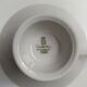 Solitaire tea cup, saucer, and dessert plate in white and gold.