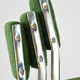 Chrome metal sled chair with green fabric