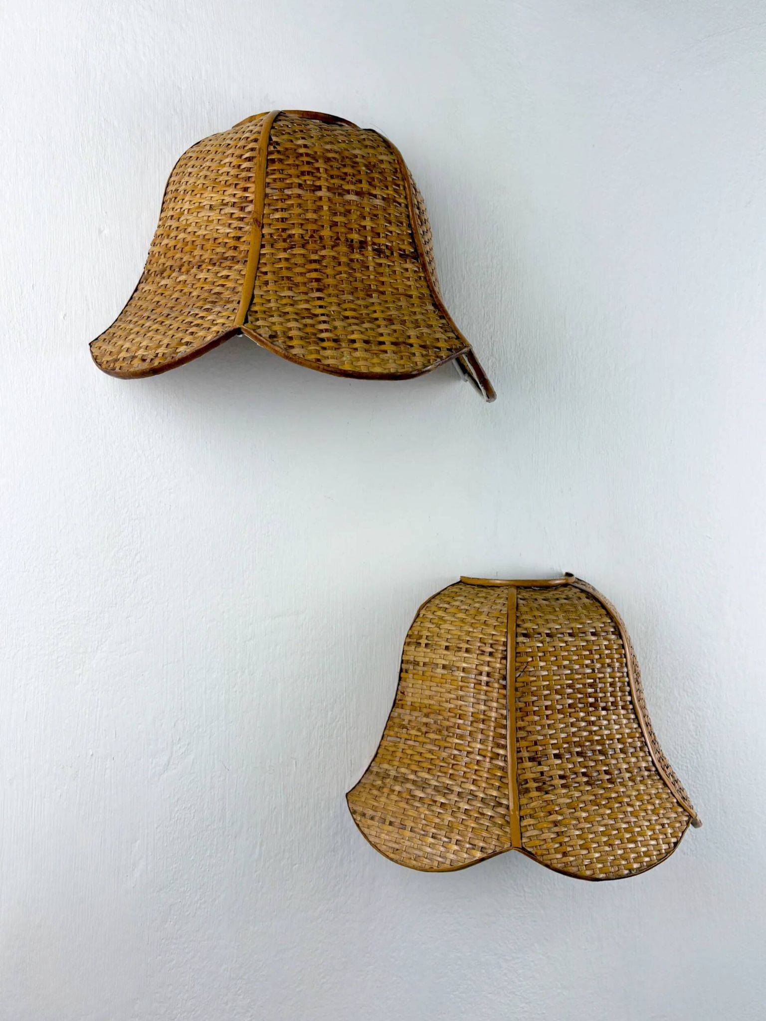 Pair of vintage woven rattan wall shades, Italy 1970s