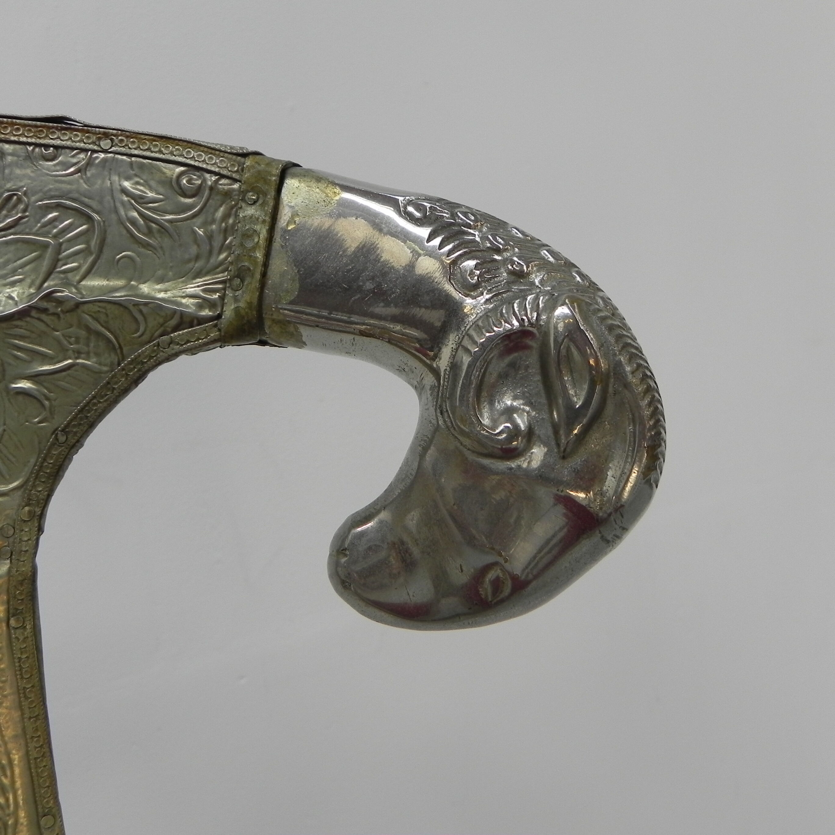 Dining chair upholstered with stamped tin