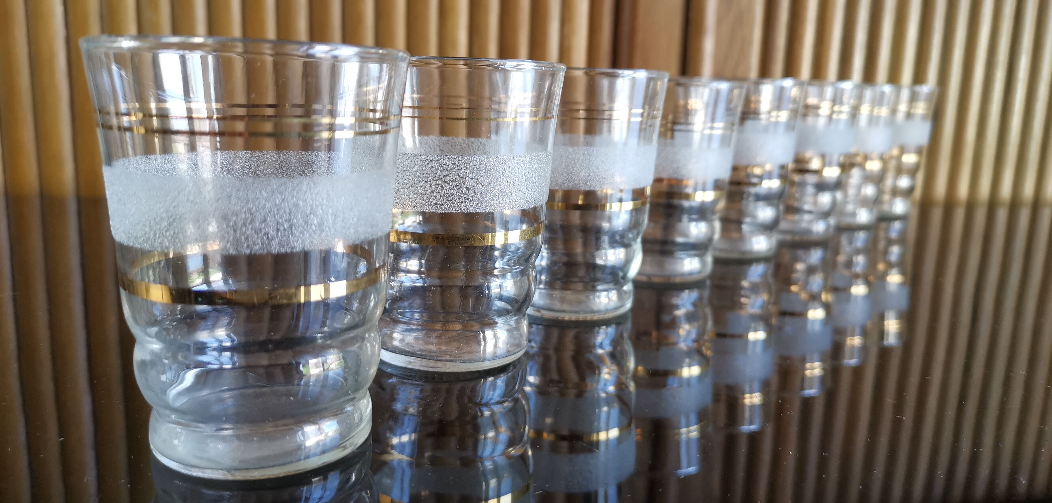 8 granite glasses bordered gold 1950s