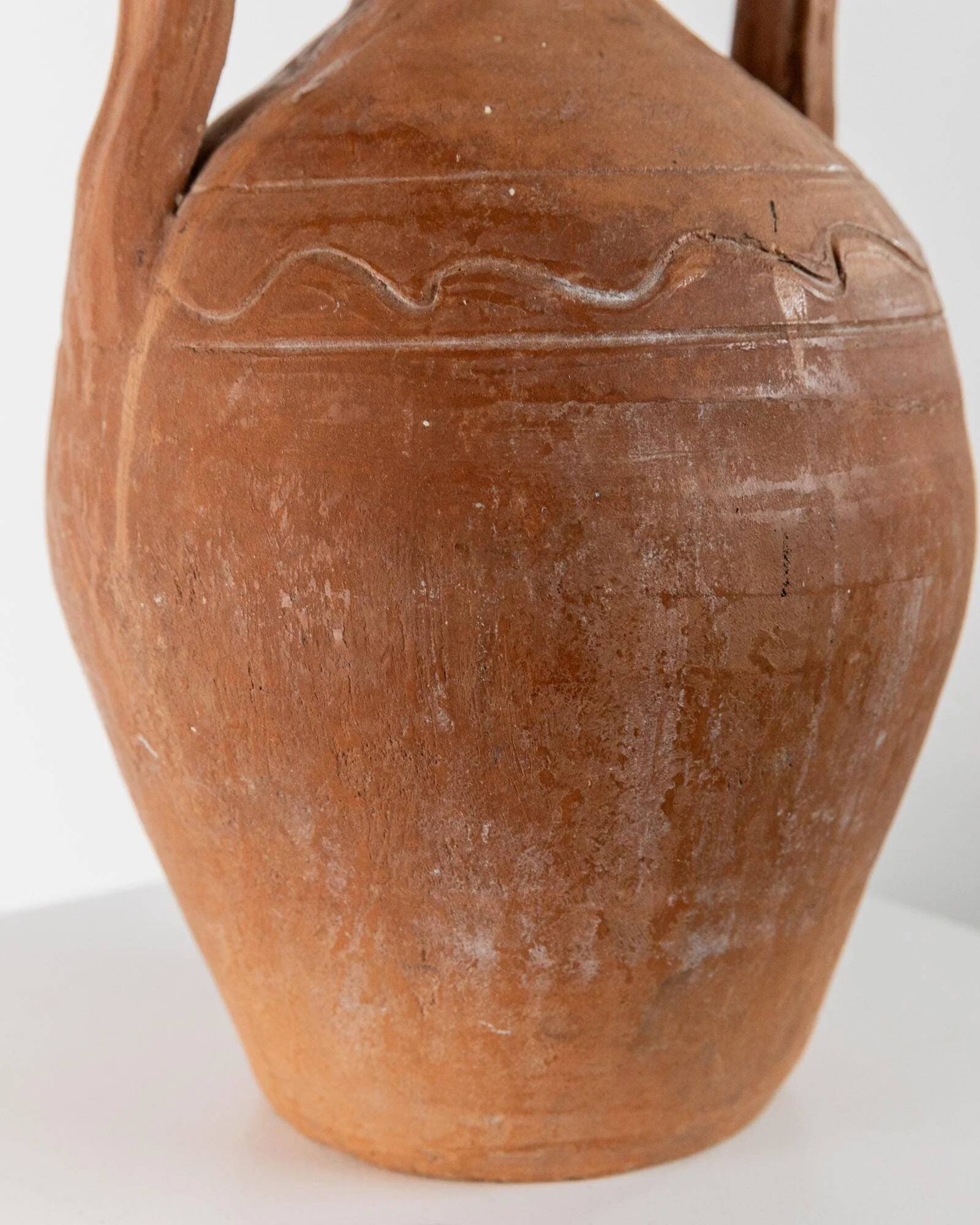 Vintage terracotta amphora vase from the early 19th century, handmade Italian jug with two handles.