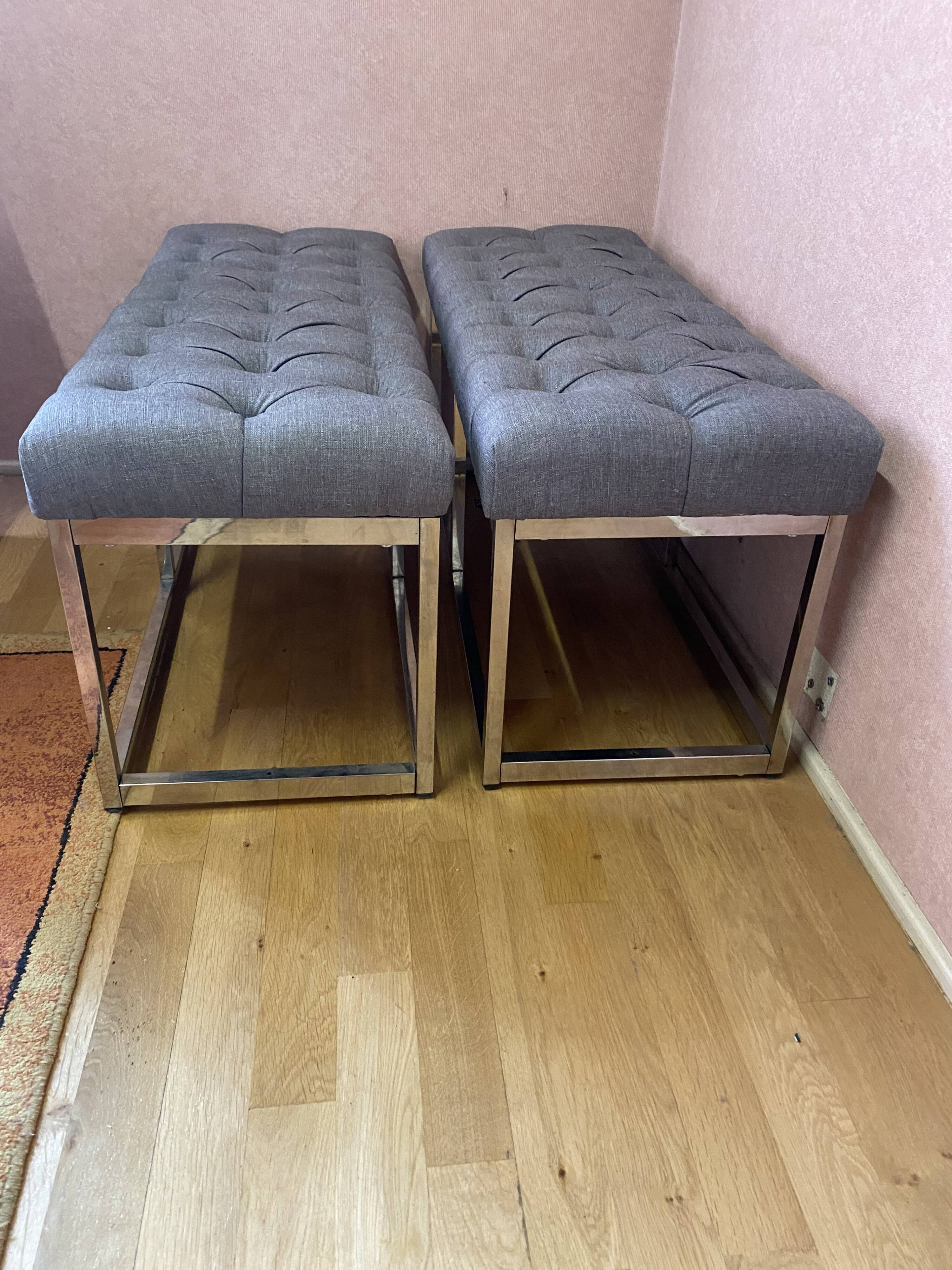 Pair of benches in chrome metal and padded gray fabric
