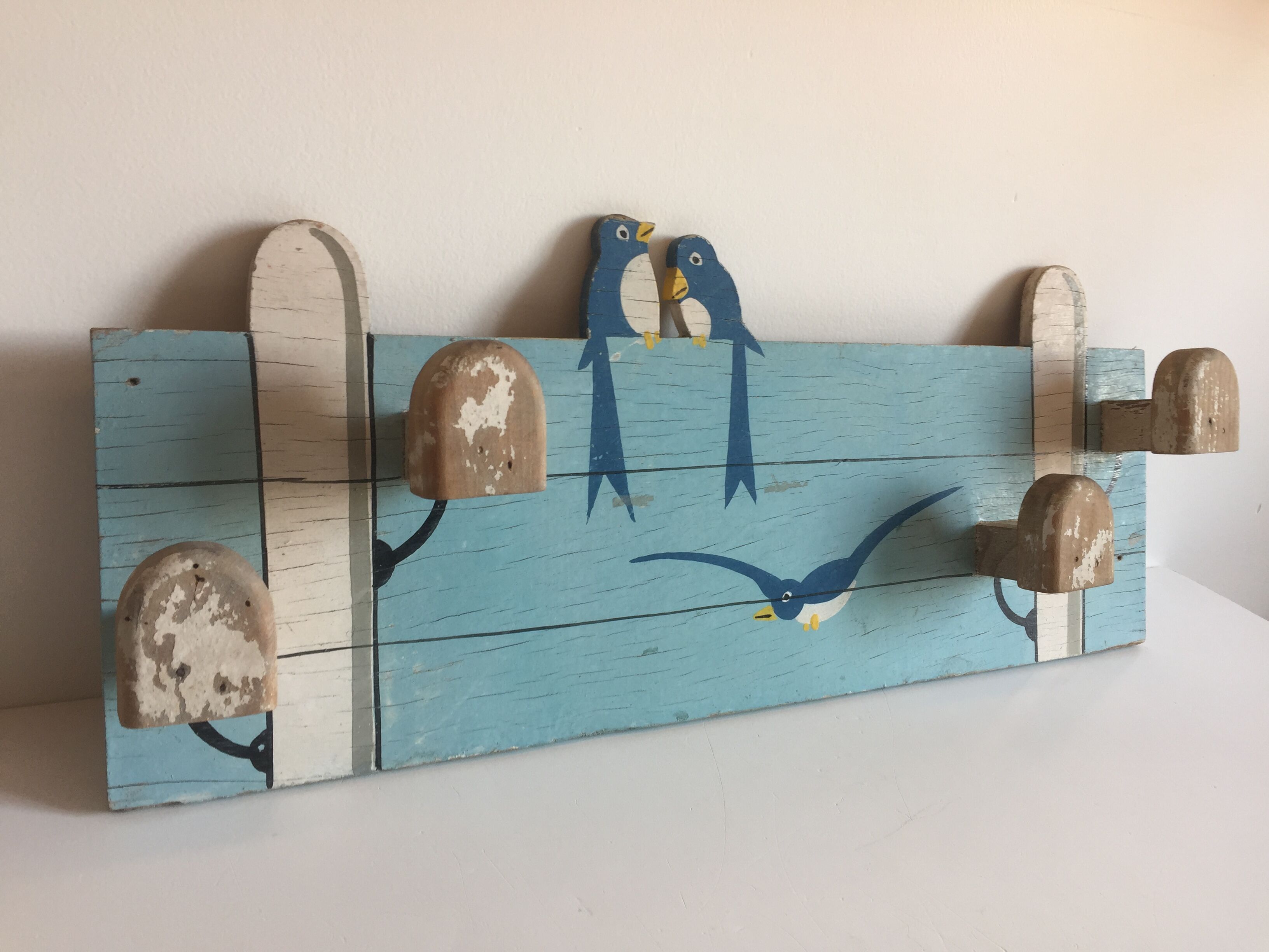 Coat rack with vintage swallows
