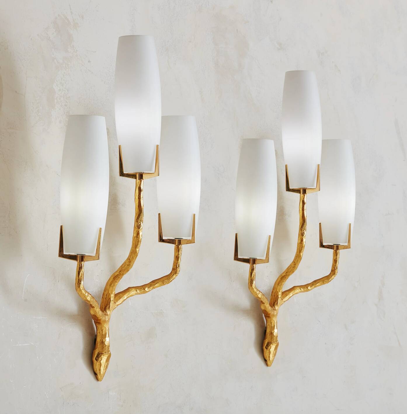 Pair of wall lights by Maison Arlus by Felix Agostini in bronze.