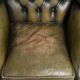 Vintage cowhide leather Chesterfield wingback armchair in a green colour