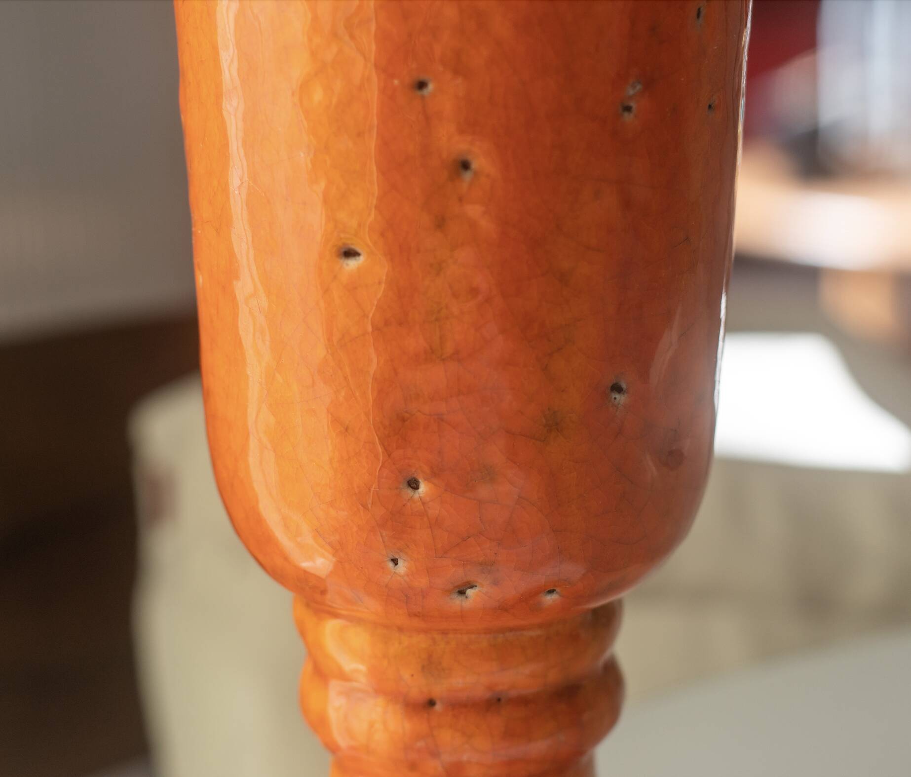Orange glazed terracotta vase