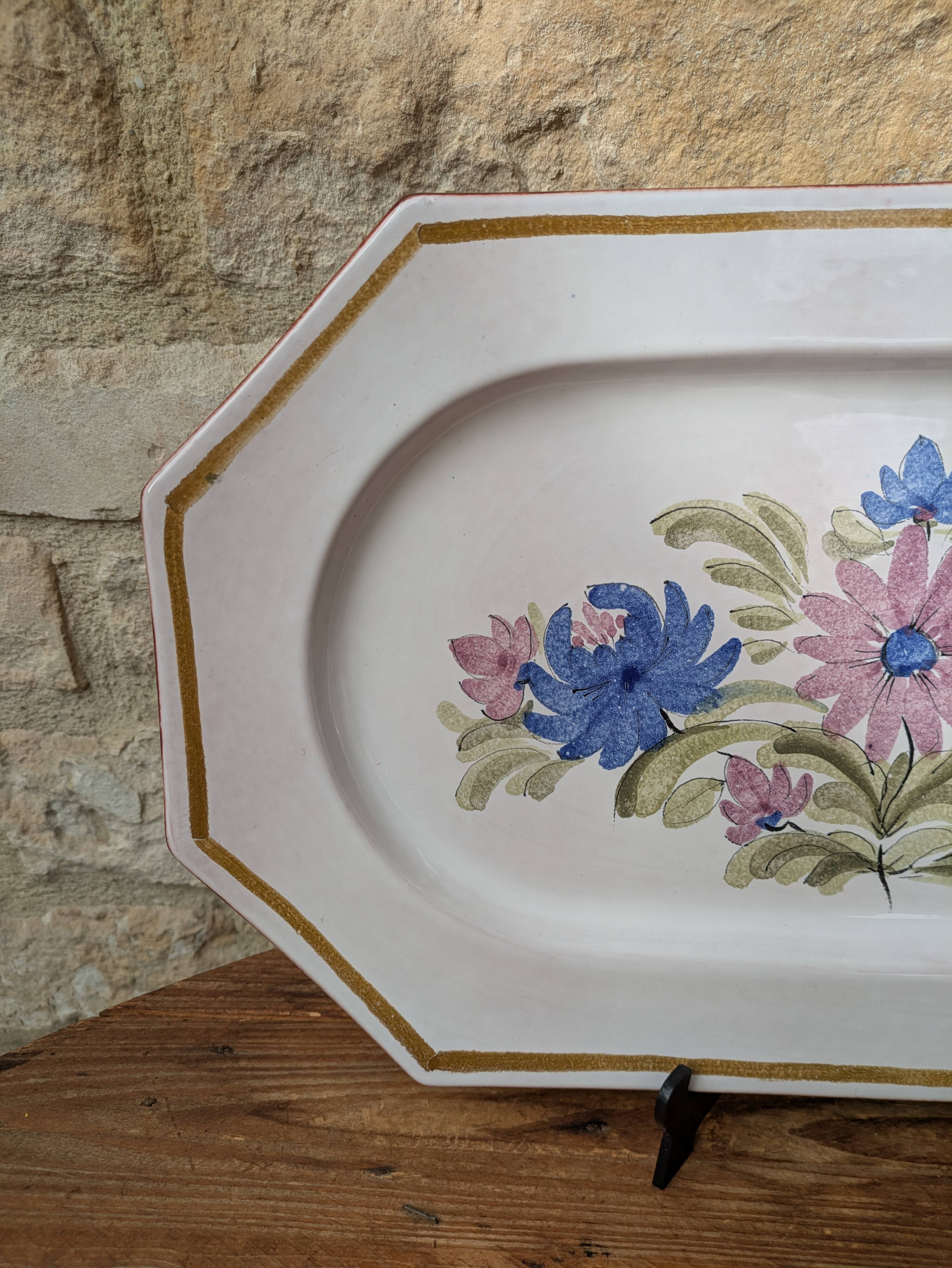 Rectangular earthenware dish with a glazed finish, decorated with a bouquet of flowers.