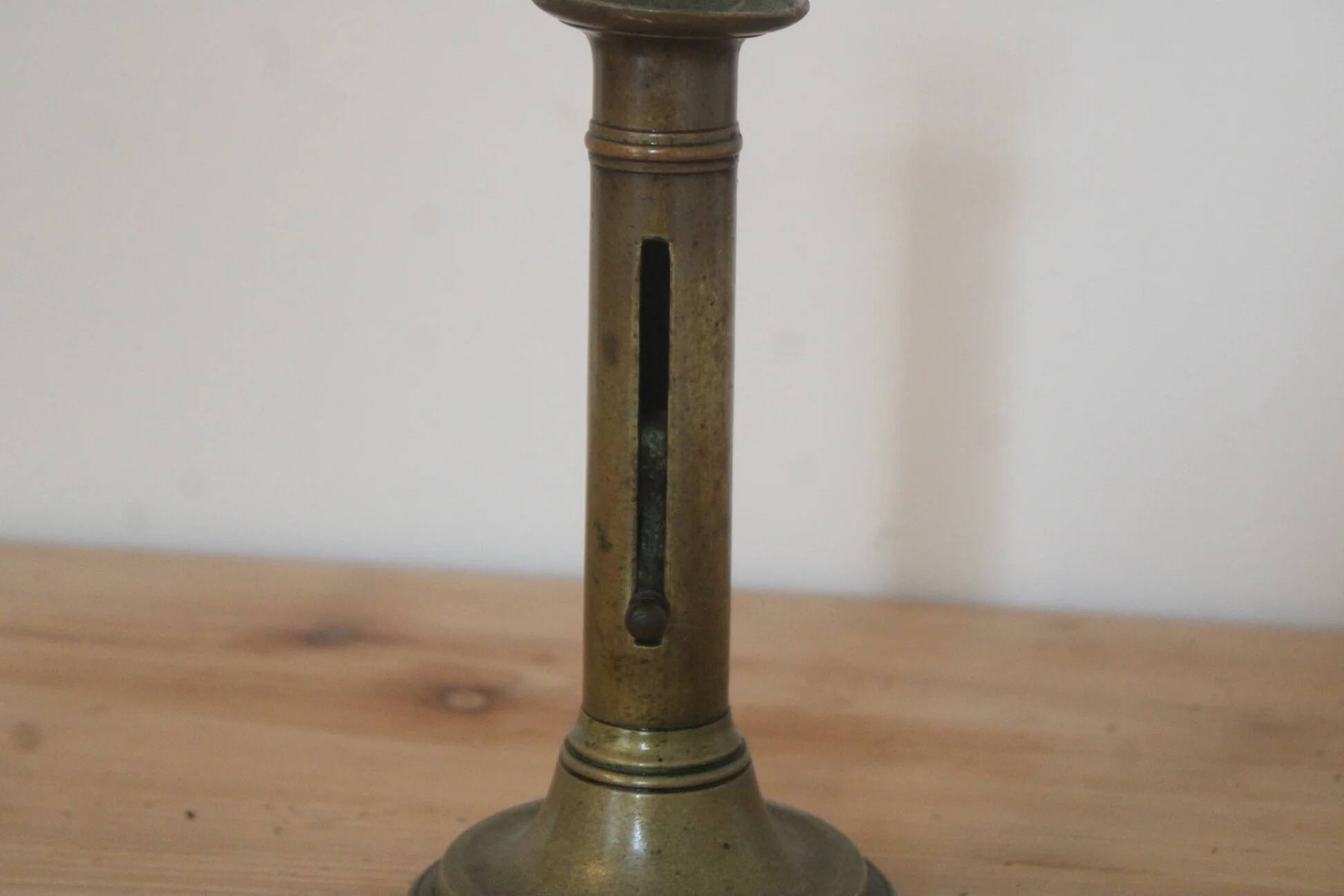 Antique brass push candle holder – vintage patinated candlestick H20 cm