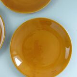 Set of 8 ocher enameled ceramic dinner plates