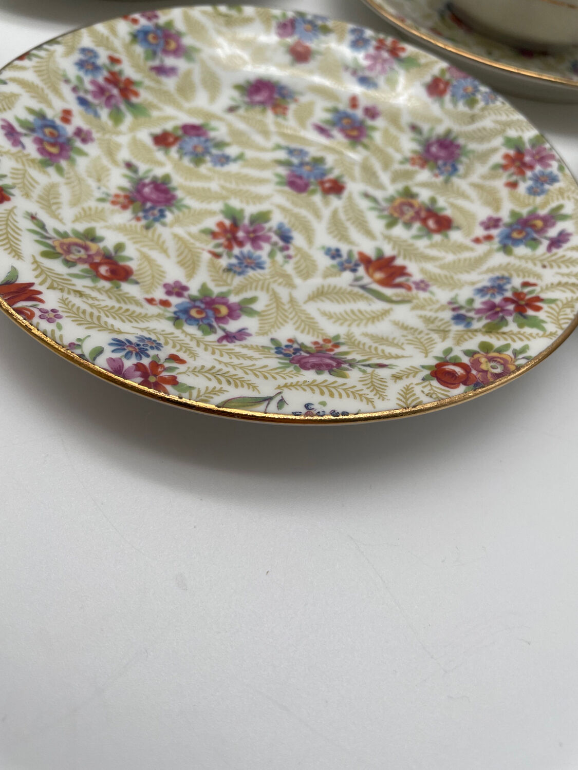 Set of 8 Limoges porcelain coffee cups from France with floral and gold pattern