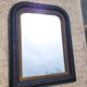 Antique mirror in Napoléon III style, blackened with beaded frieze, 42x55cm.