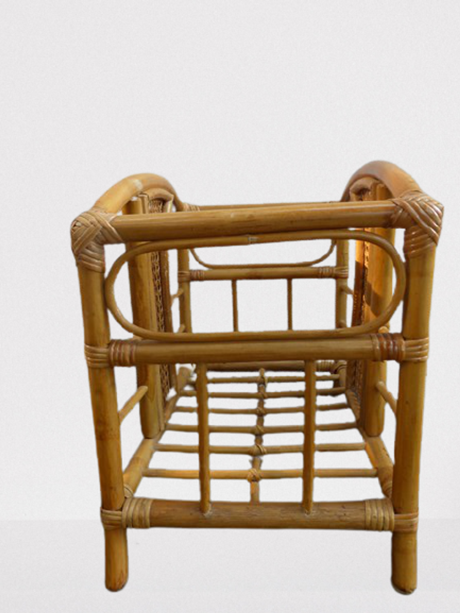 Wicker rattan magazine rack with vintage caning