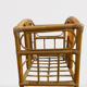 Wicker rattan magazine rack with vintage caning