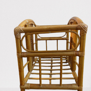 Wicker rattan magazine rack with vintage caning
