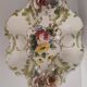 Openwork ceramic bowl with raised flower decoration in Italian style.