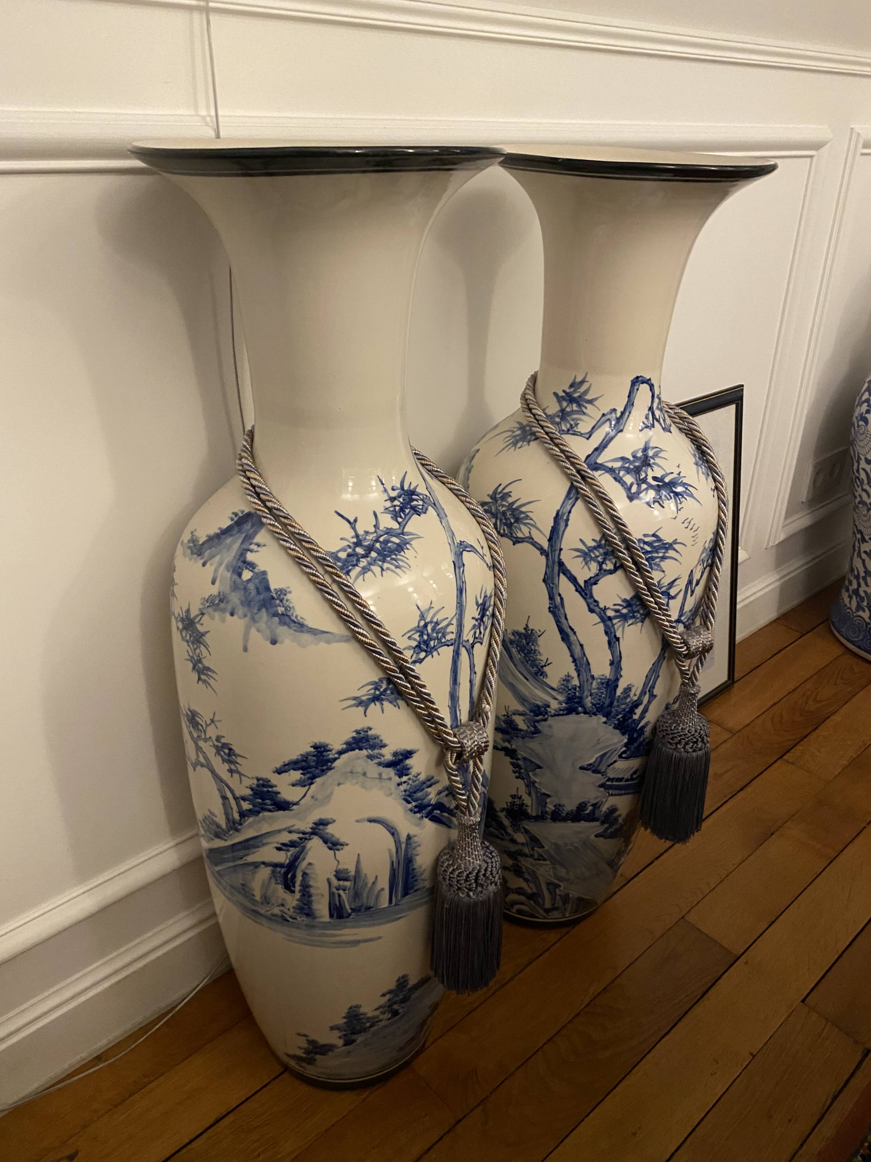 Set of two very large white and blue ceramic vases.