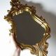 Vintage Rococo wall mirror, gold, Italy, circa 1950-1970, wood and gilded stucco.