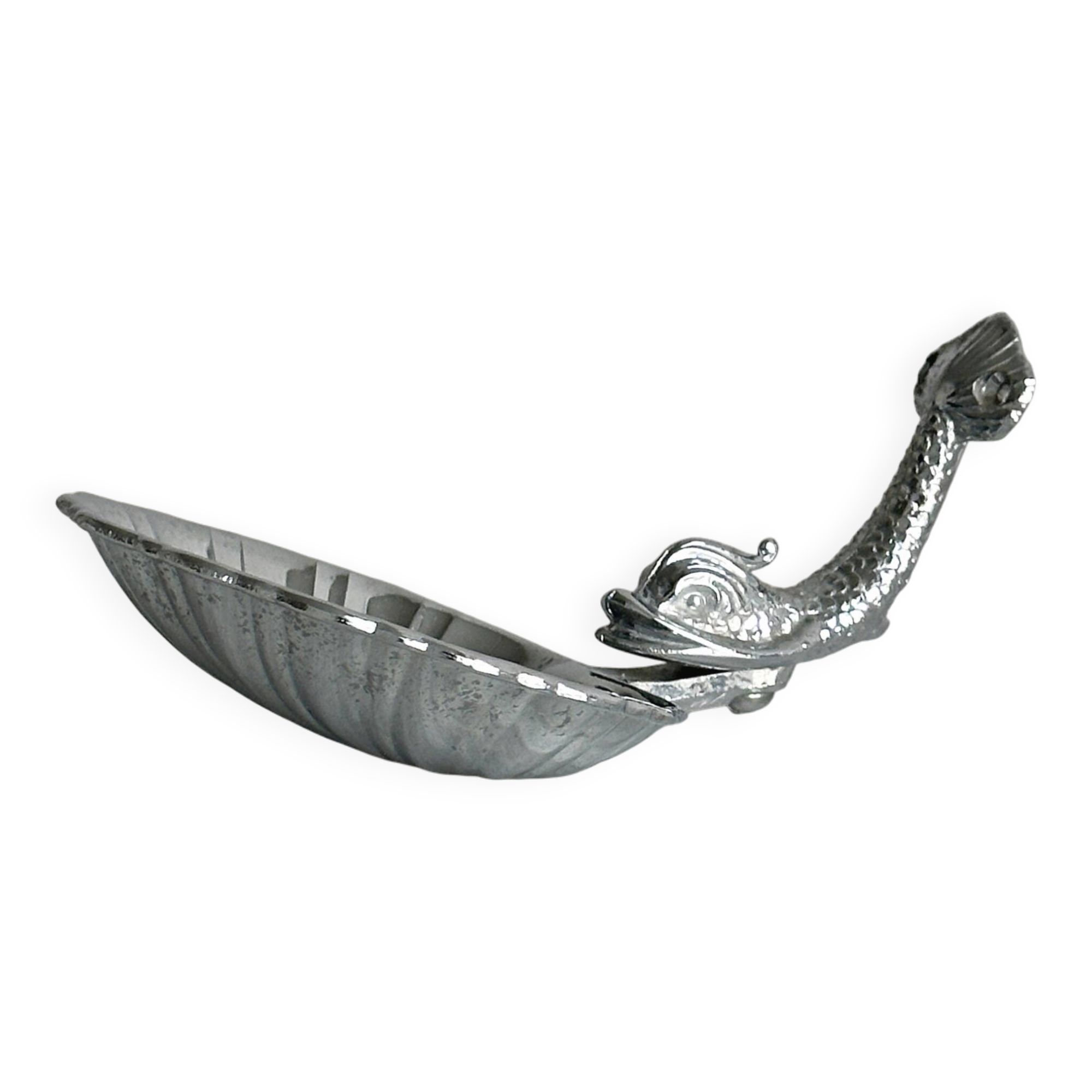 Soap dish, shell-shaped lightweight metal catchall.