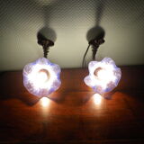 Wall sconces with opalines in the shape of corollas and black metal support