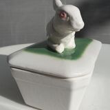 Pot terrine rabbit of Bavent in white earthenware on square of greenery