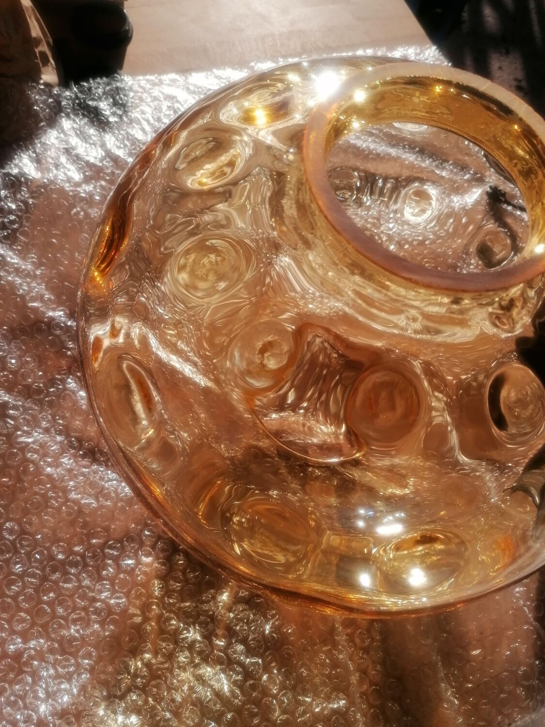 Vintage suspension ball in amber glass