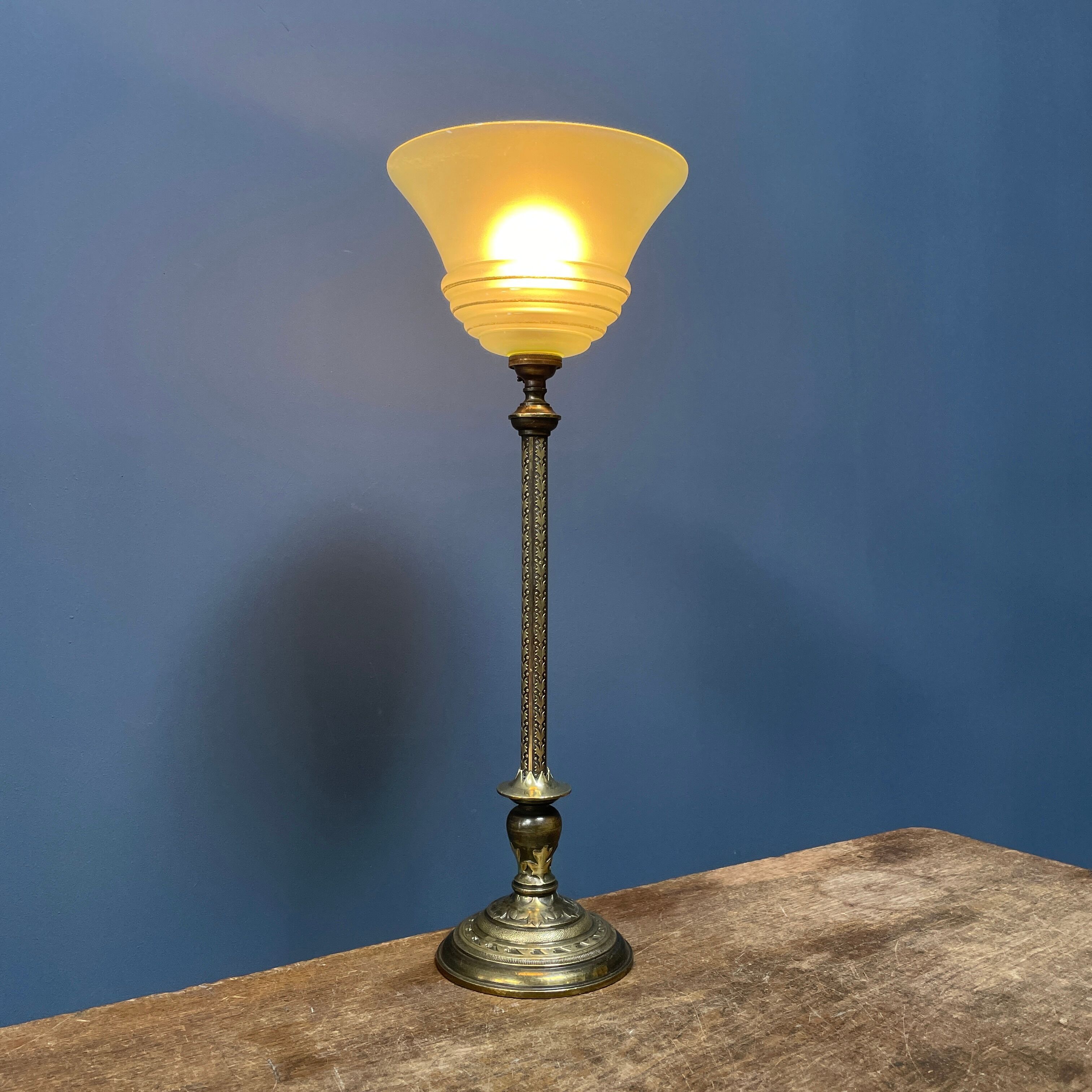 Ornate brass table lamp with mint green glass shade