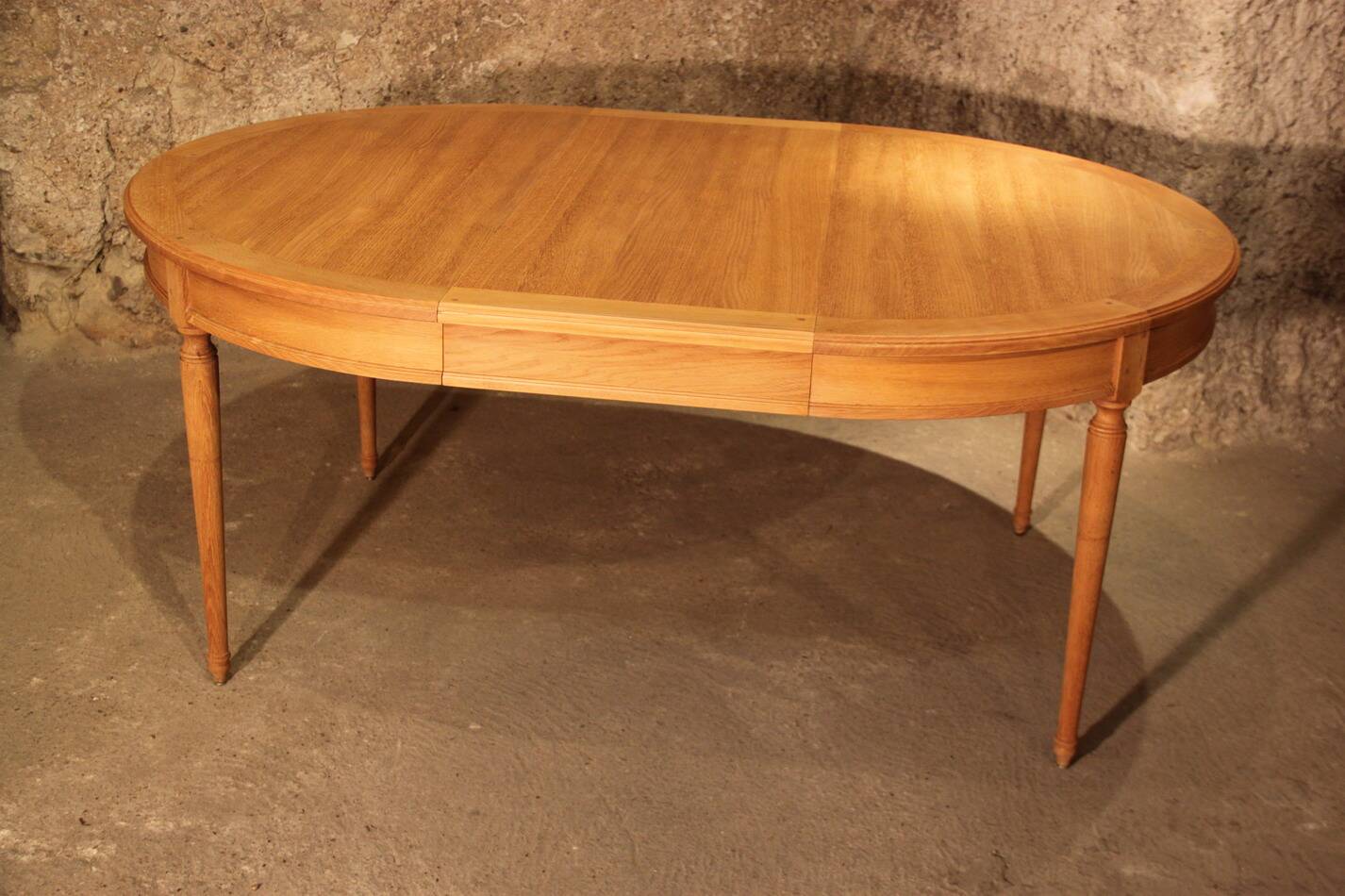Oval light oak table with extension