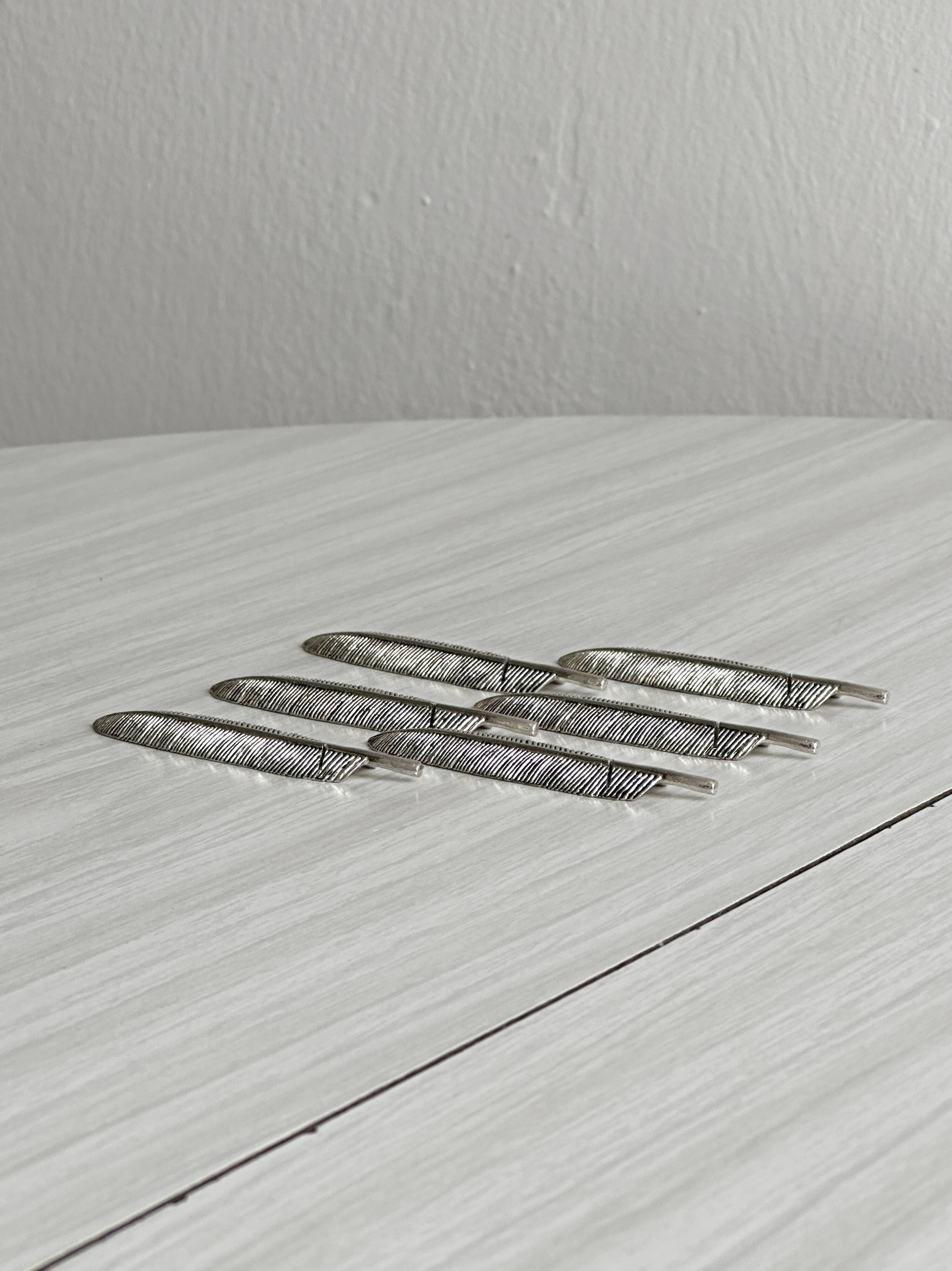 Set of 6 metal knife rests, name holders.
