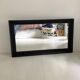 1950s mirror, matte black wood with a patina.