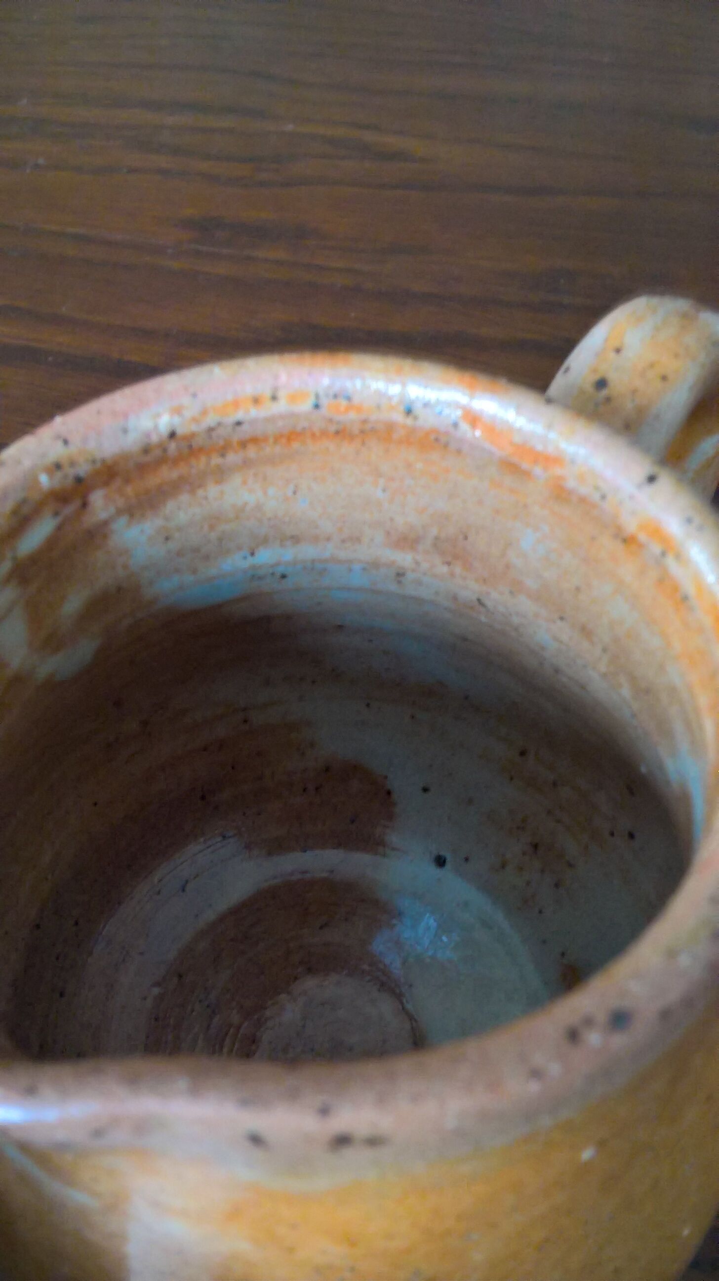 Creamy milk pot in sandstone