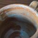 Creamy milk pot in sandstone