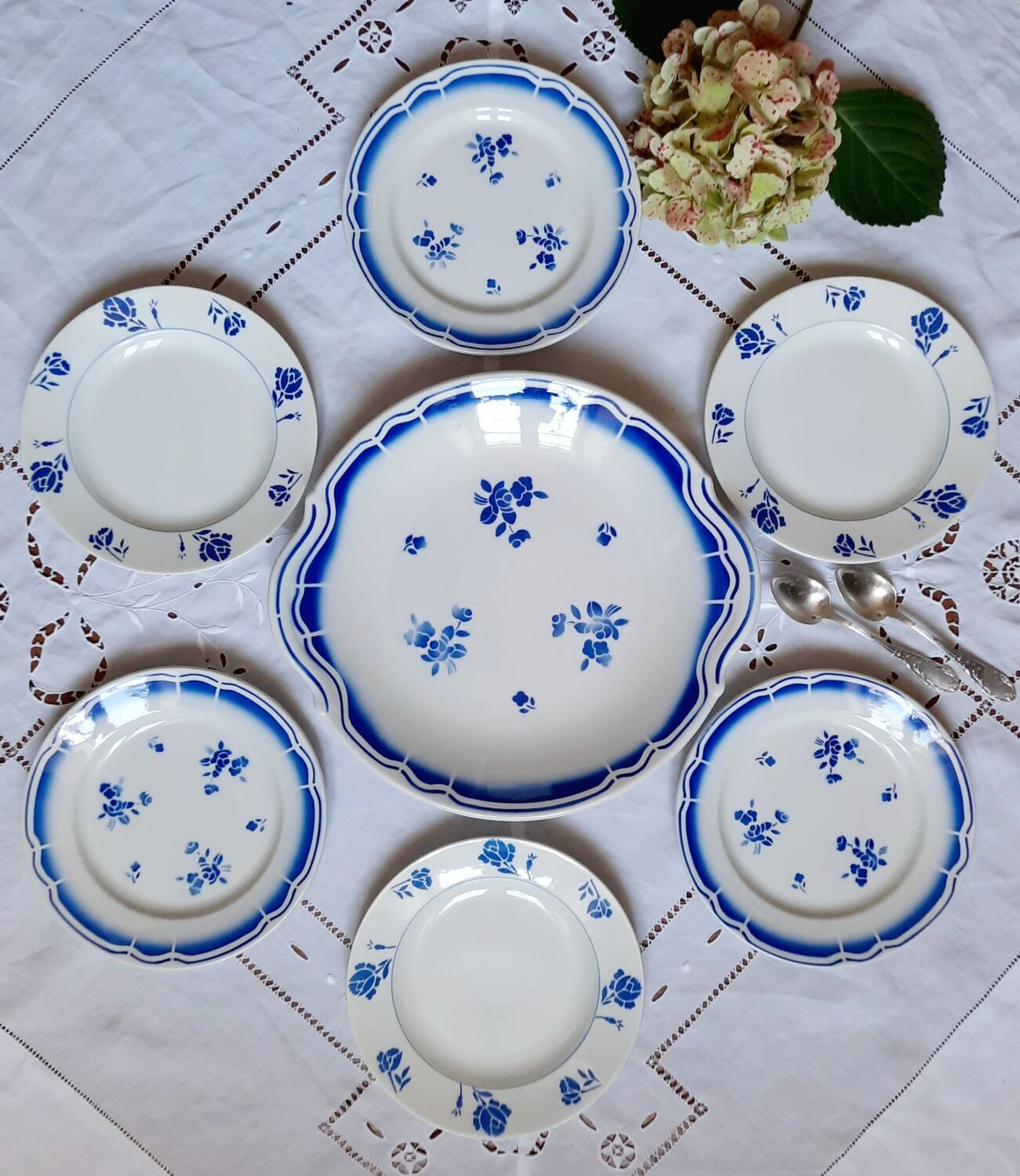 Mismatched old dessert plates accompanied by a dish