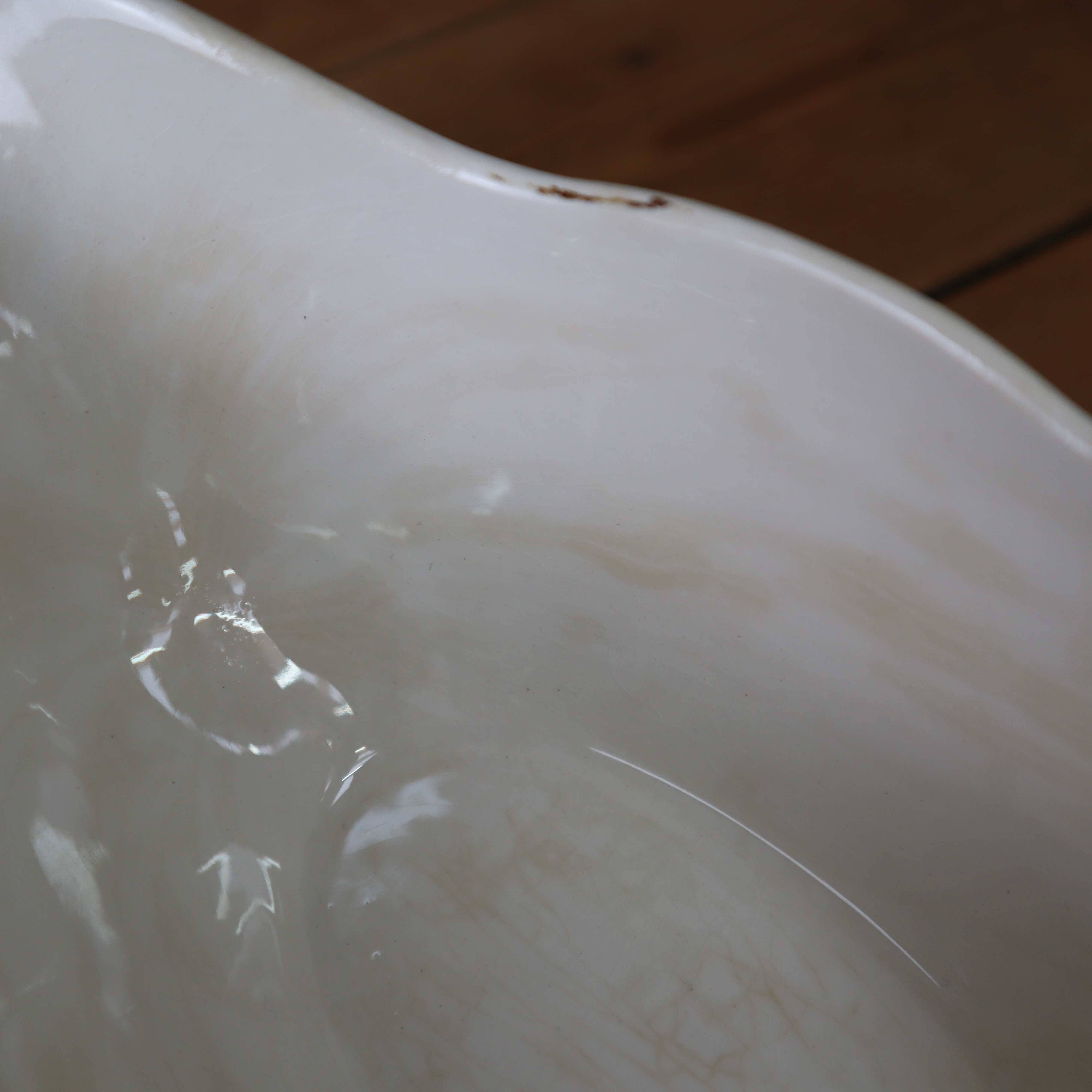 Old Sarreguemines earthenware sauce boat, Romantic model