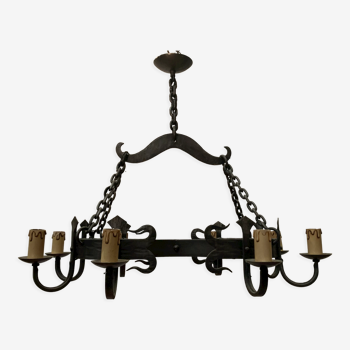 Wrought iron chandelier has eight arms of light XX century