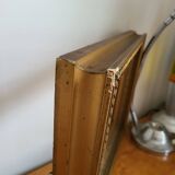 Frame with channels in wood and gilded stucco