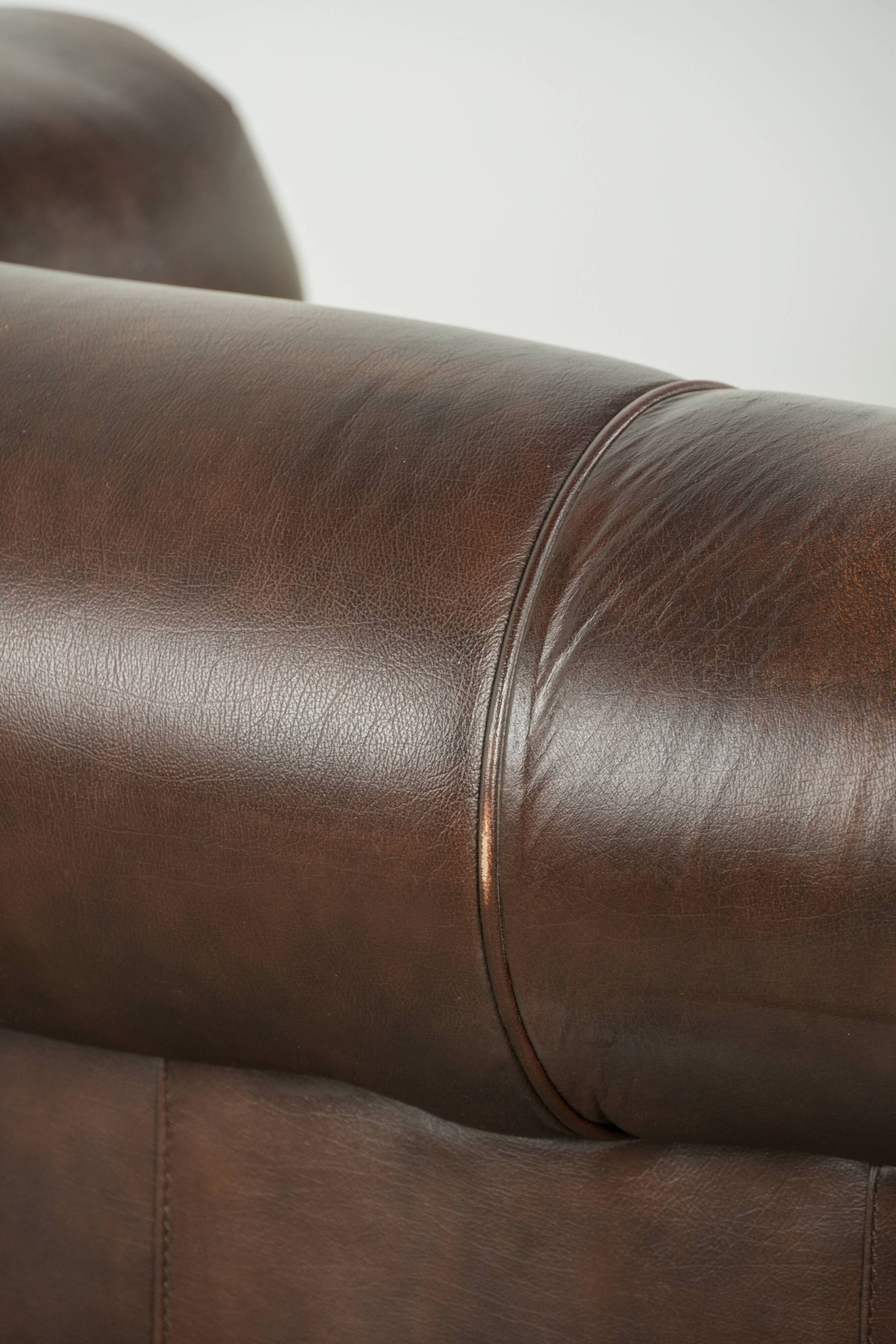 Set of a smooth chesterfield sofa and armchair with a timeless English look