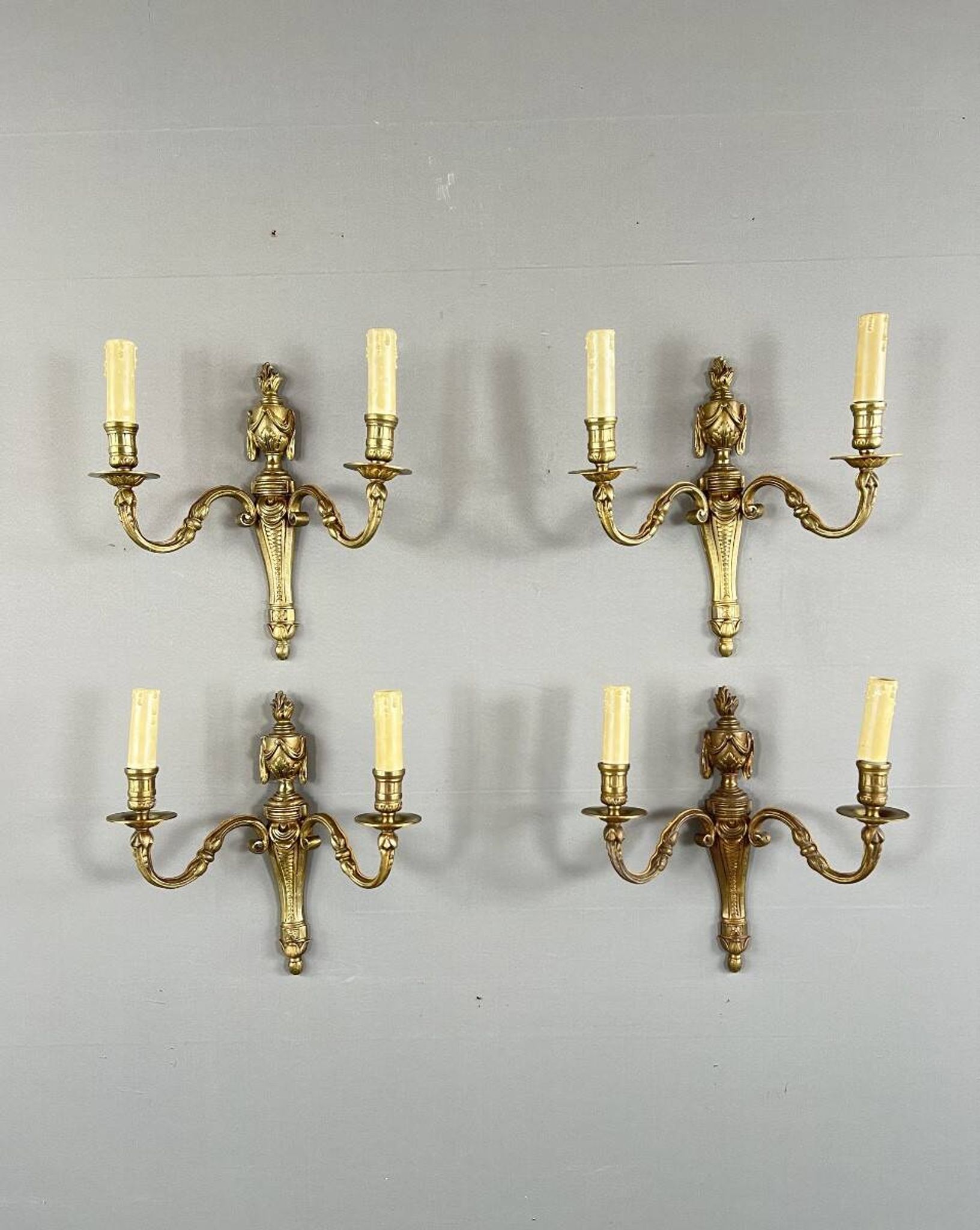 Set of four bronze wall sconces, Louis XVI style, 20th century.
