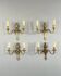 Set of four bronze wall sconces, Louis XVI style, 20th century.