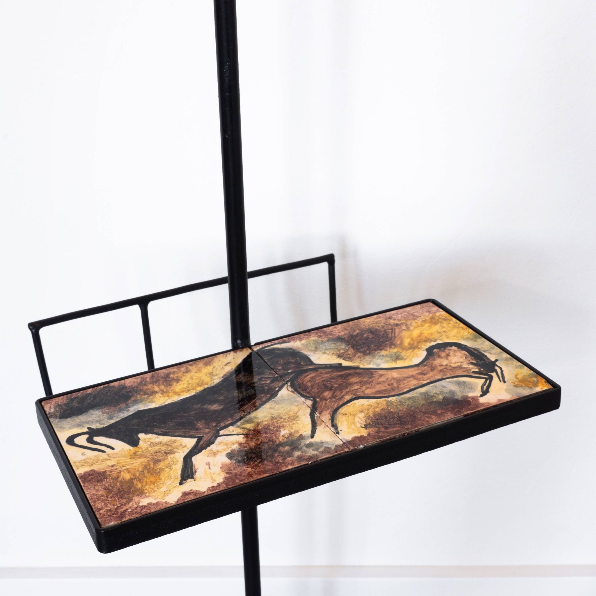 Black metal magazine rack floor lamp with ceramic shelf