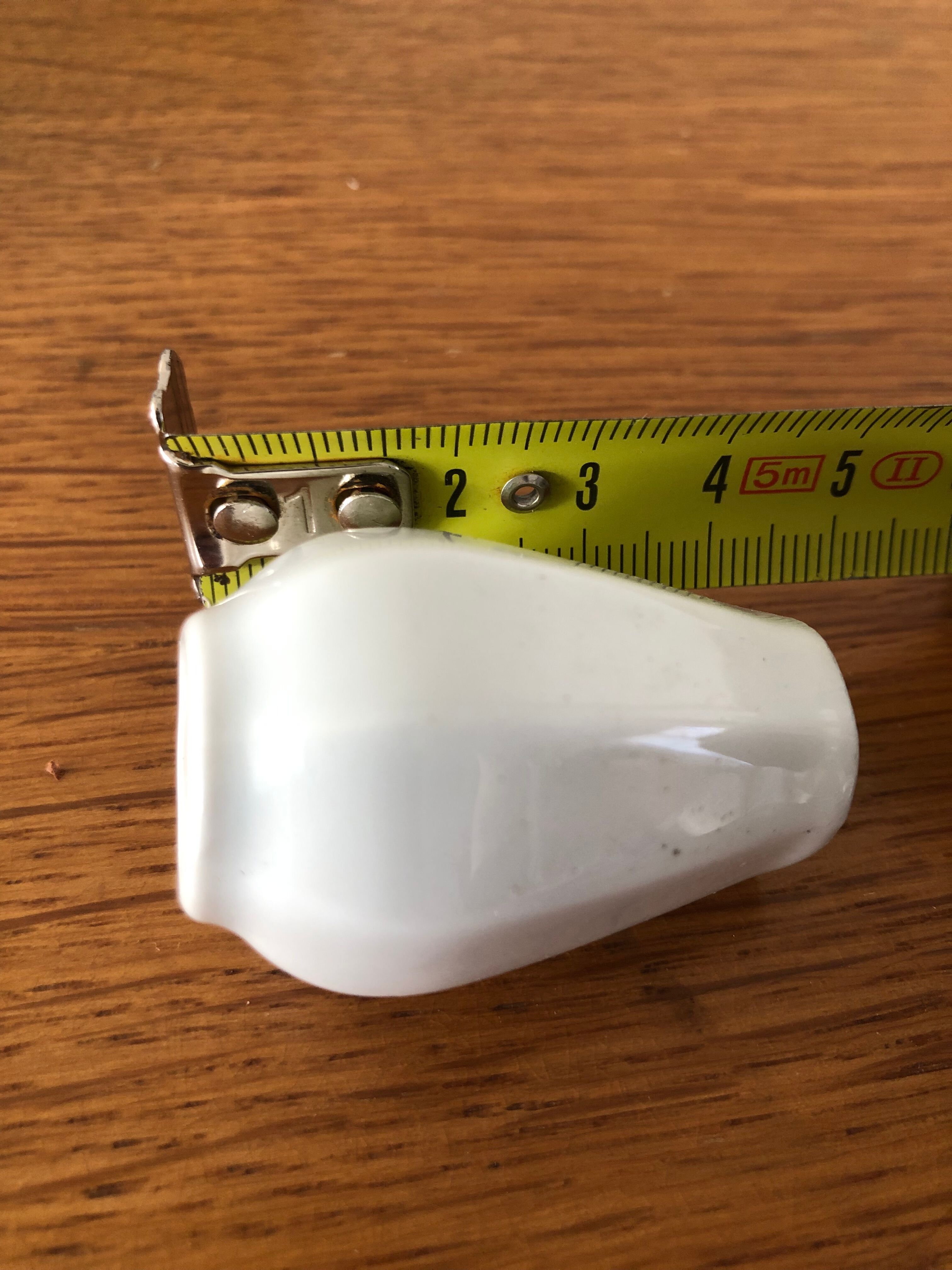 8 miniature vases in white earthenware