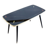 Table basse en verre aux pieds fuseaux