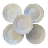 5 mismatched old white plates.
