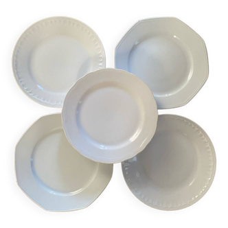 5 mismatched old white plates.