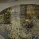 Neo-classical cast iron and glass eglomisé coffee table from the 1940s.
