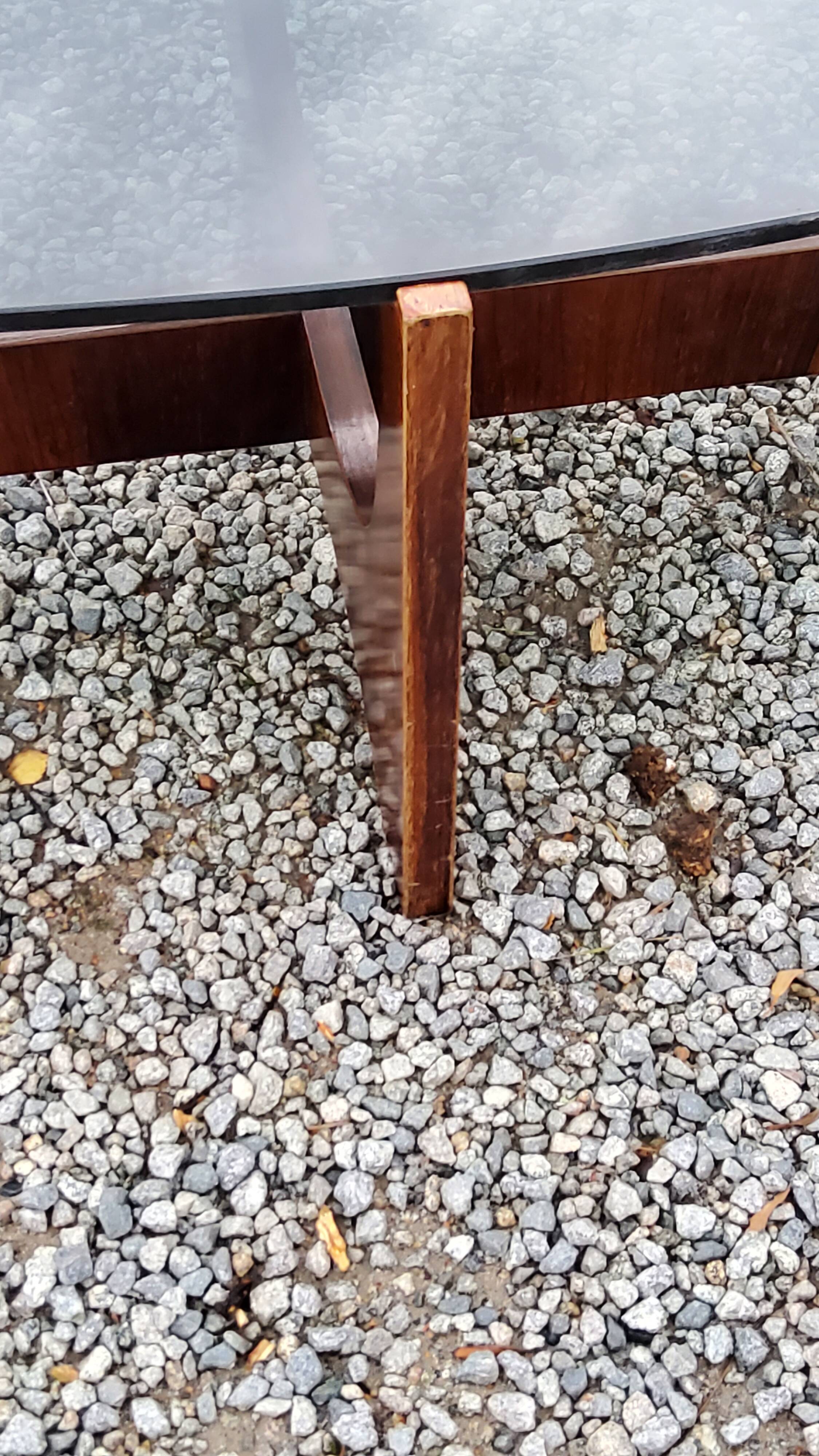Designer coffee table by Hugues Poignant in rosewood and smoked glass from the 70s
