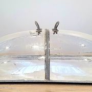 Large serving platter with lid, in silver metal.