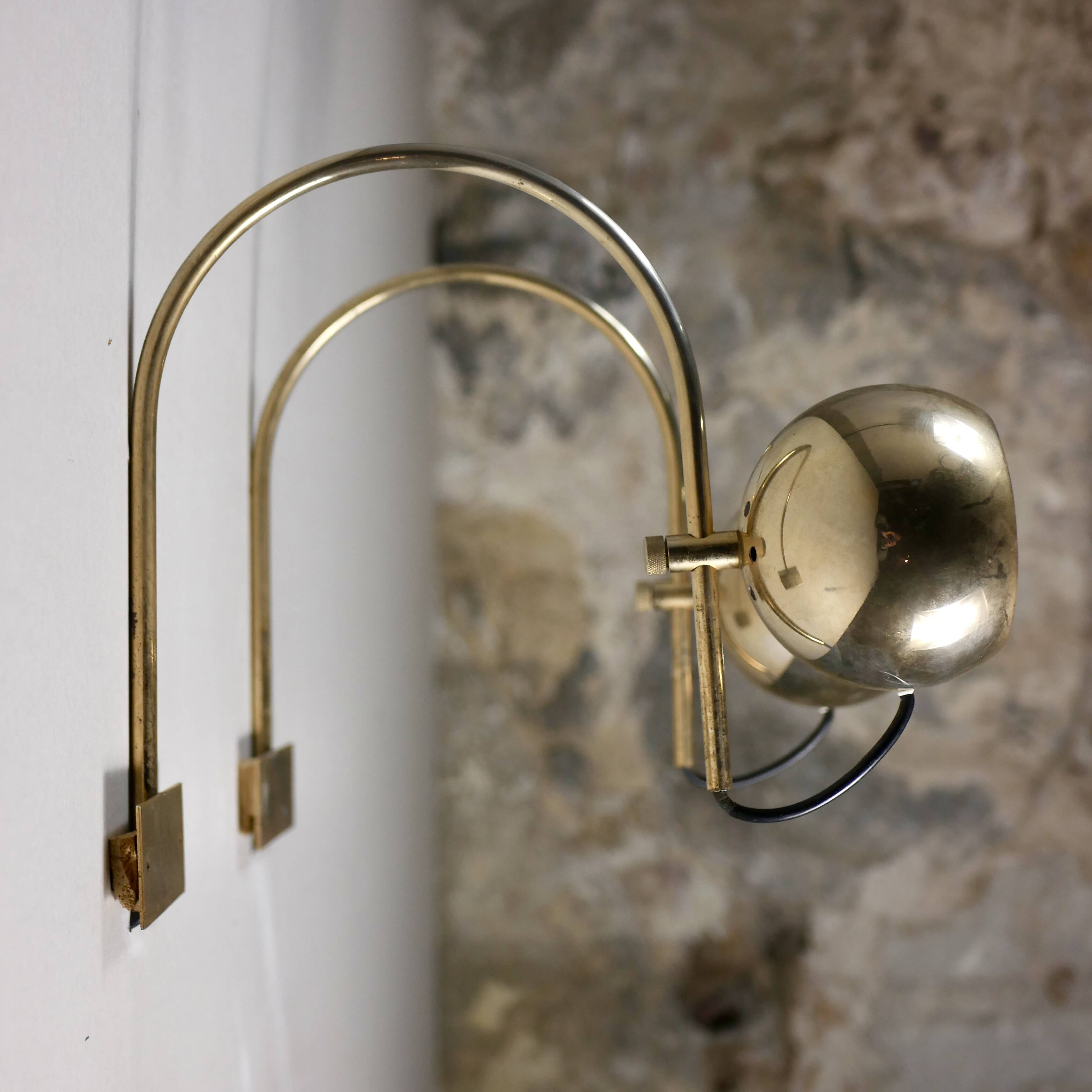 Pair of brass eyeball wall lights